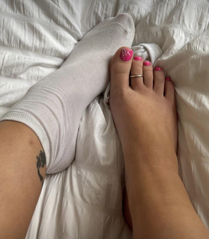 Ash removes her white socks to show her beautiful pink toes